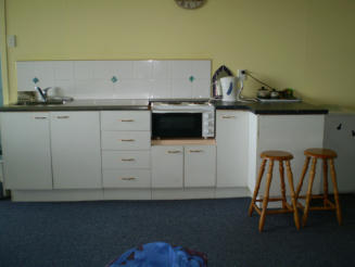 Unit has full cooking facilities, including sink, stove, toaster, kettle, etc