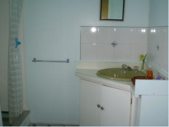 Bathroom is clean and modern with a well appointed shower.